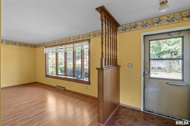 entrance foyer featuring hardwood / wood-style floors