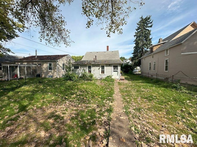view of yard featuring fence and central AC unit