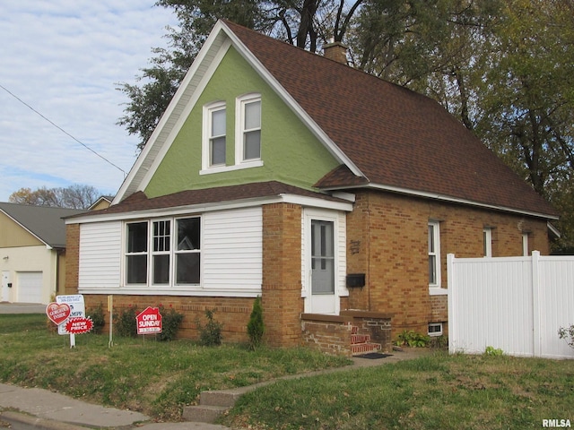 view of front of home with a front yard