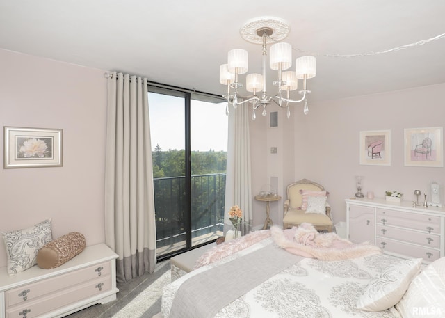 bedroom with carpet floors and an inviting chandelier