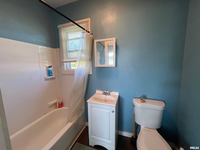 full bath featuring shower / bathtub combination with curtain, toilet, and vanity