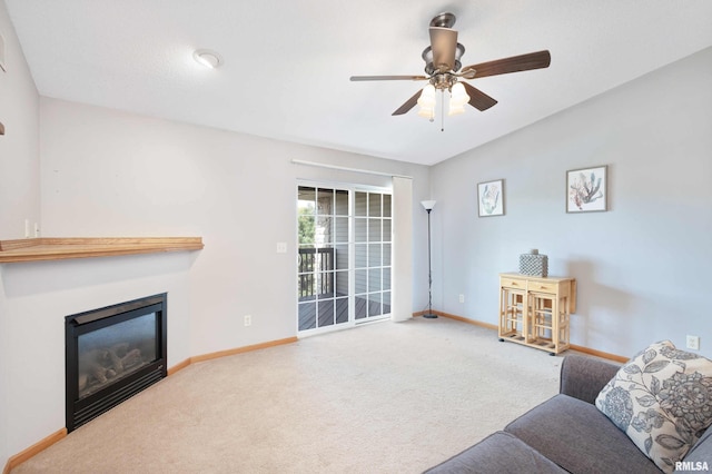 living room with carpet floors, vaulted ceiling, and ceiling fan