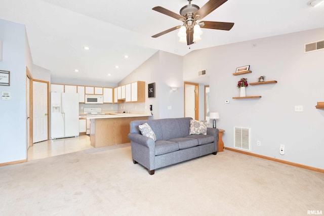 carpeted living room featuring ceiling fan and high vaulted ceiling