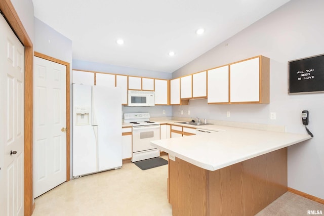 kitchen featuring vaulted ceiling, white cabinets, white appliances, kitchen peninsula, and sink