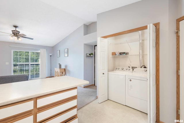 interior space with ceiling fan, independent washer and dryer, and light colored carpet