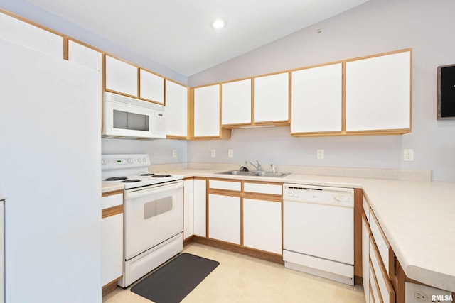 kitchen featuring white cabinets, lofted ceiling, sink, and white appliances