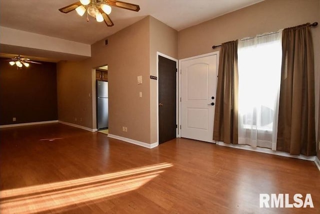 unfurnished room featuring ceiling fan and hardwood / wood-style floors