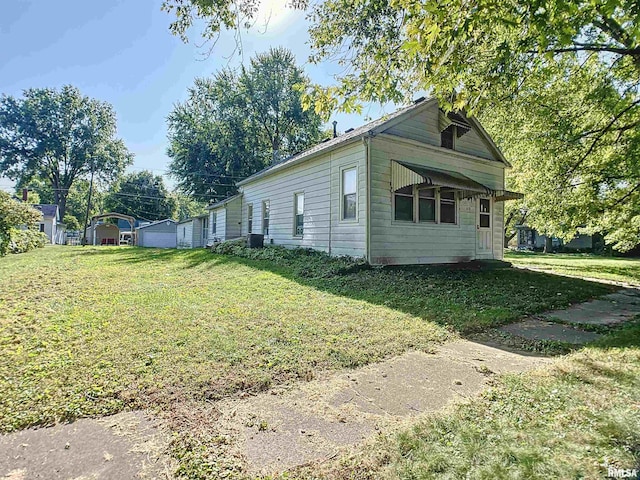 view of property exterior with a yard