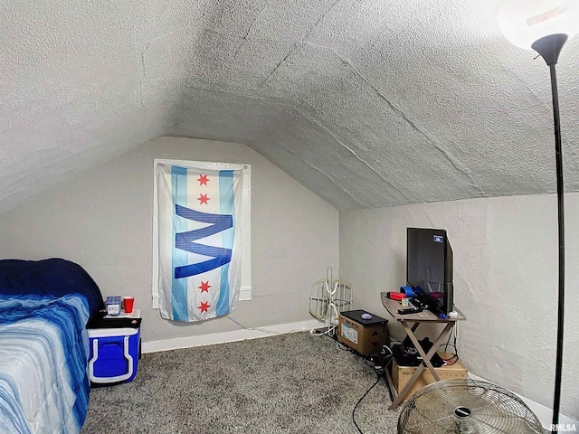 carpeted bedroom featuring a textured ceiling and vaulted ceiling