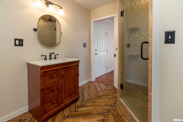 bathroom featuring vanity, hardwood / wood-style floors, and an enclosed shower