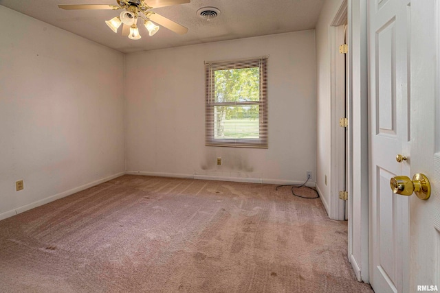 carpeted empty room with ceiling fan