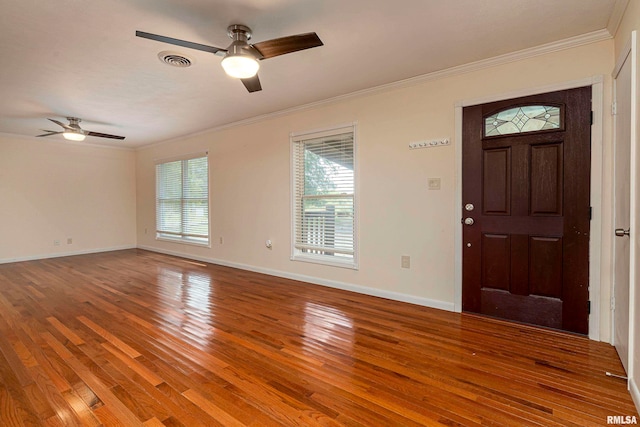 entryway featuring ornamental molding, hardwood / wood-style floors, and ceiling fan