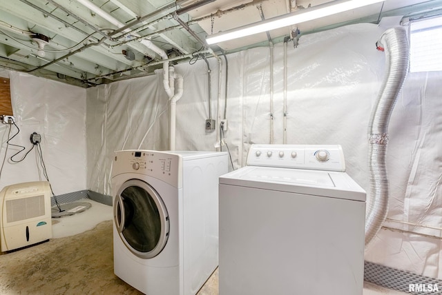 washroom featuring washer and dryer