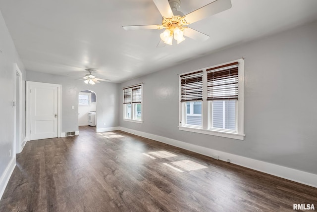 interior space with dark wood-type flooring and ceiling fan