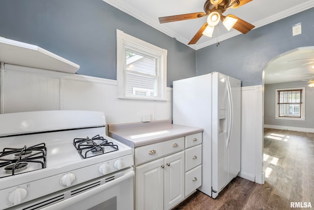 kitchen featuring white cabinetry, white appliances, dark hardwood / wood-style flooring, ceiling fan, and ornamental molding