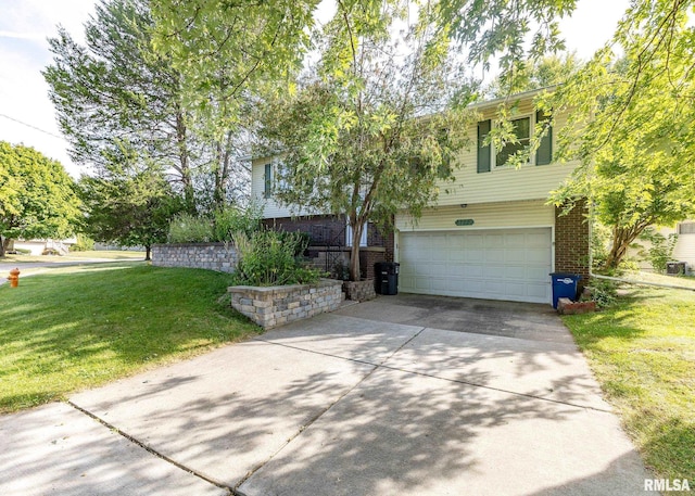 view of front of property with a garage and a front lawn