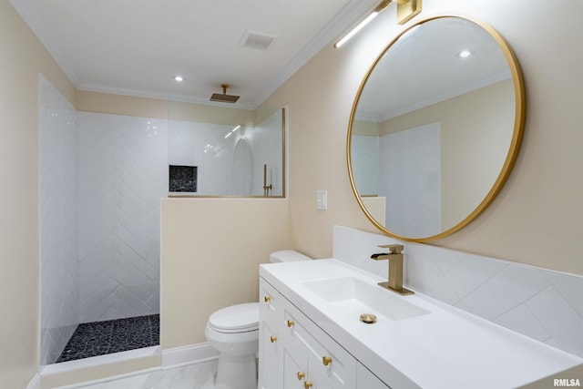 bathroom featuring a tile shower, crown molding, toilet, and vanity