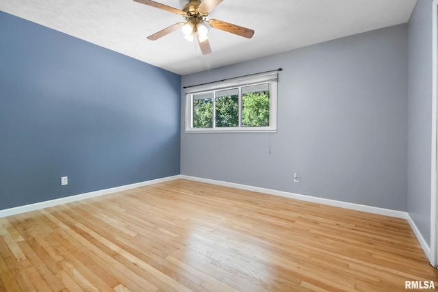 empty room featuring light wood-type flooring and ceiling fan