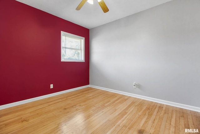 unfurnished room featuring ceiling fan and hardwood / wood-style flooring