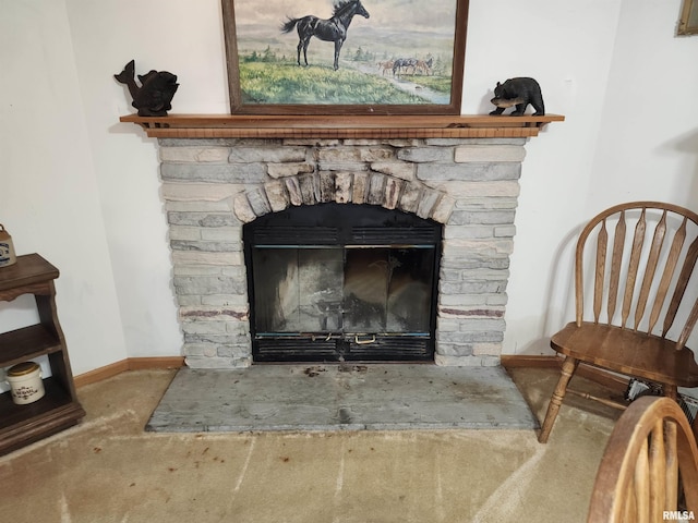 room details with carpet and a stone fireplace