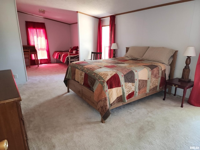 carpeted bedroom with ornamental molding and multiple windows