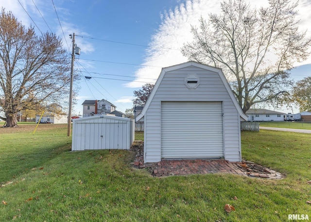 view of outbuilding featuring a lawn