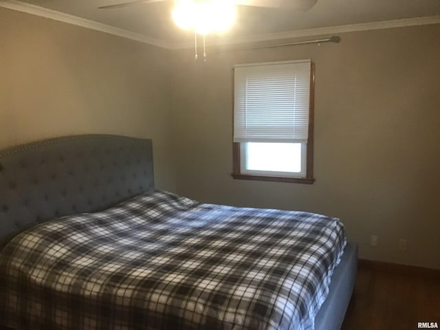 bedroom featuring ceiling fan and crown molding