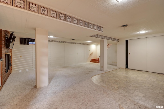 basement with a fireplace