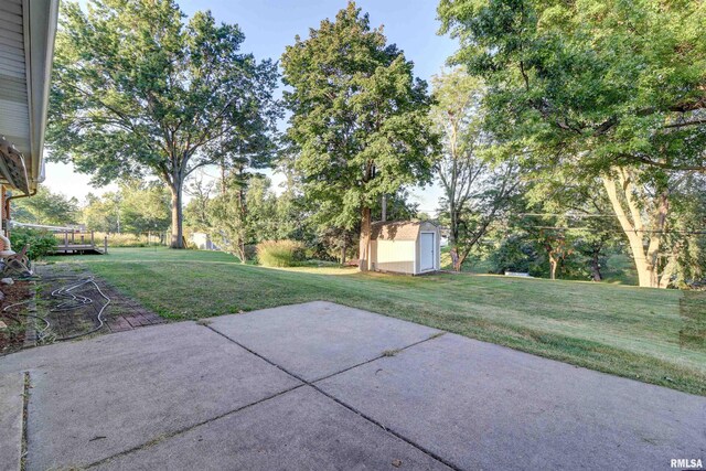 view of patio / terrace featuring a shed