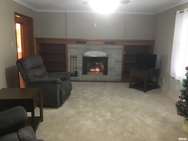 living room featuring a fireplace, ceiling fan, ornamental molding, and light carpet