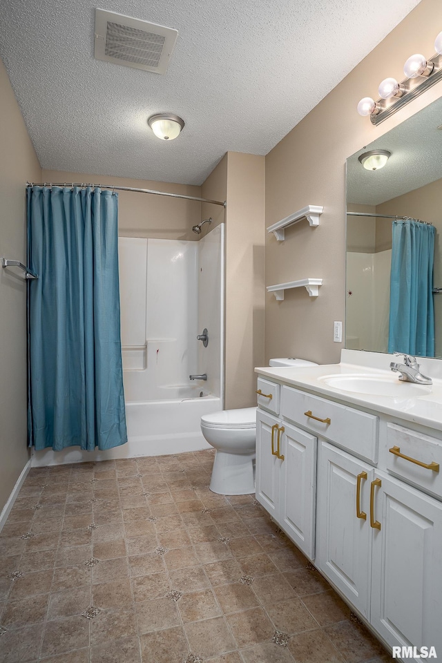 full bathroom featuring vanity, toilet, a textured ceiling, and shower / bath combo