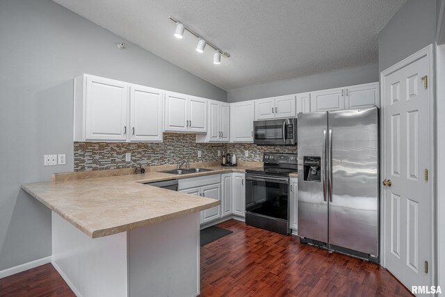 kitchen featuring stainless steel appliances, white cabinetry, a textured ceiling, and dark hardwood / wood-style floors