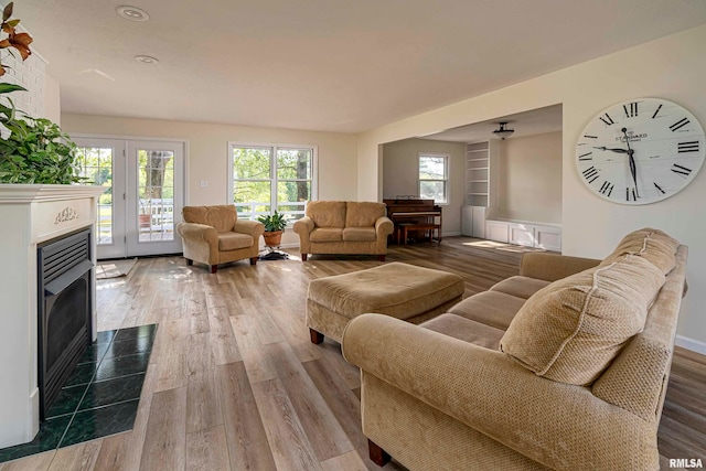 living room with light hardwood / wood-style flooring