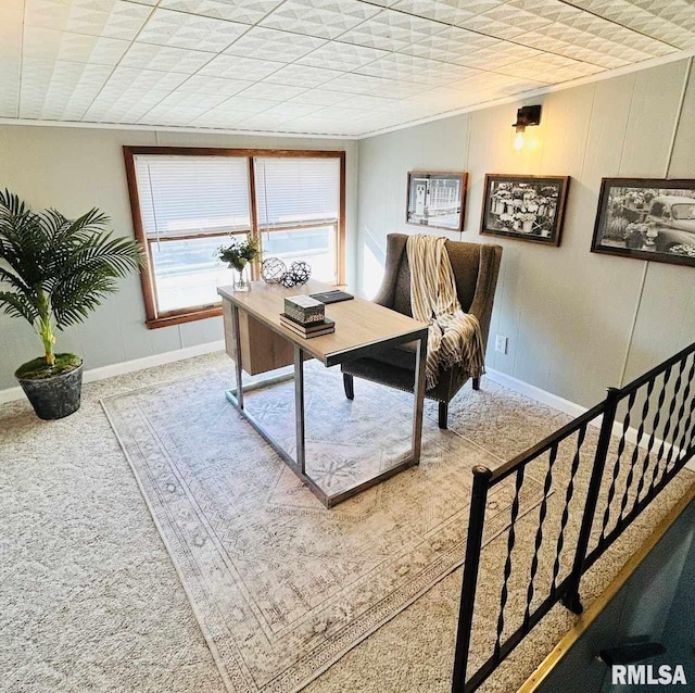 carpeted home office with crown molding