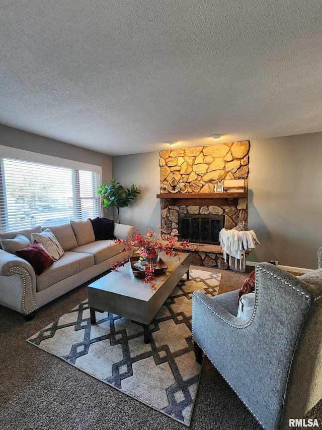 carpeted living room with a fireplace and a textured ceiling