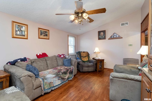 living room with a textured ceiling, wood-type flooring, lofted ceiling, and ceiling fan