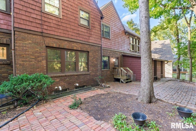 rear view of property featuring a patio area