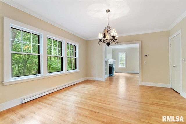 unfurnished dining area featuring ornamental molding, baseboard heating, a chandelier, and light hardwood / wood-style floors