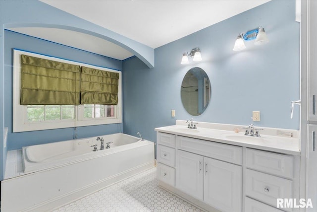 bathroom with a bath and vanity