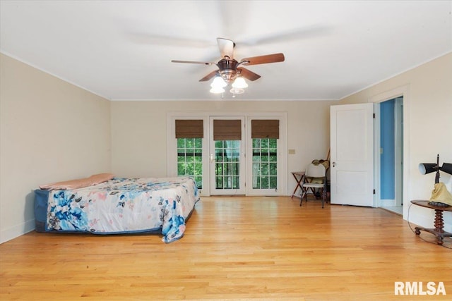 bedroom with light wood-type flooring, crown molding, ceiling fan, and access to exterior