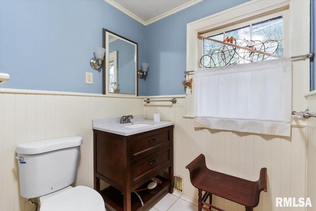 bathroom with ornamental molding, tile patterned flooring, vanity, and toilet