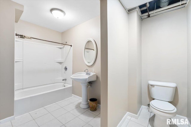 bathroom featuring shower / bath combination, tile patterned floors, and toilet