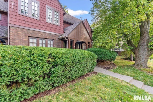 view of home's exterior featuring a lawn