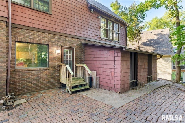 rear view of property featuring a patio area