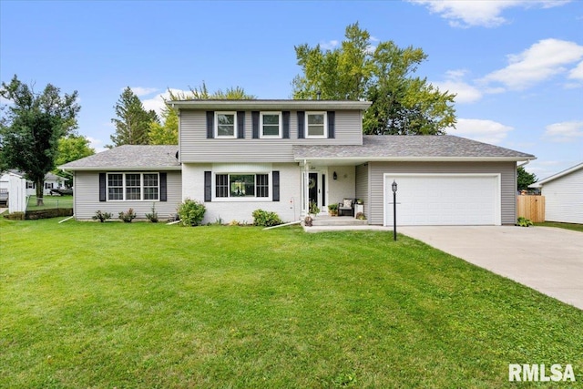 view of front of home with a garage and a front yard