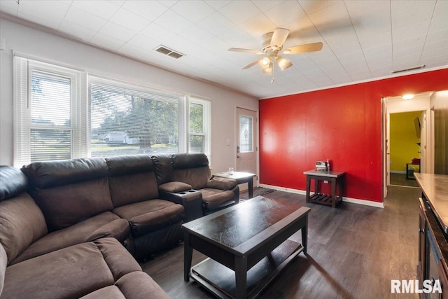 living room featuring ceiling fan, crown molding, and dark hardwood / wood-style flooring