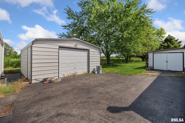 garage with a lawn