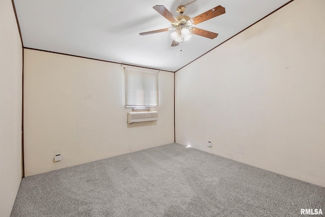 spare room featuring carpet floors, ceiling fan, and a wall mounted air conditioner