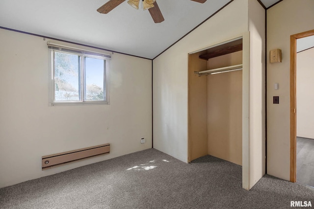 unfurnished bedroom with a closet, lofted ceiling, ceiling fan, carpet, and a baseboard heating unit