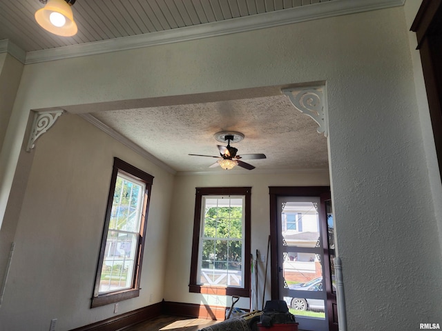 interior details with ceiling fan and ornamental molding